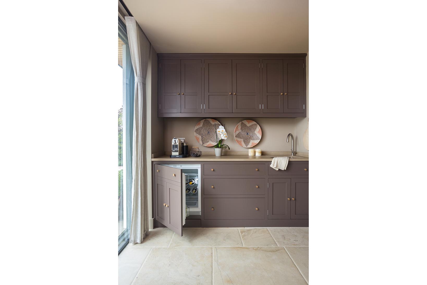 Bespoke Charlie Kingham shaker kitchen with Miele refrigerator K9122Ui and Franke stainless steel sink KBX11045 and Adobe tap.