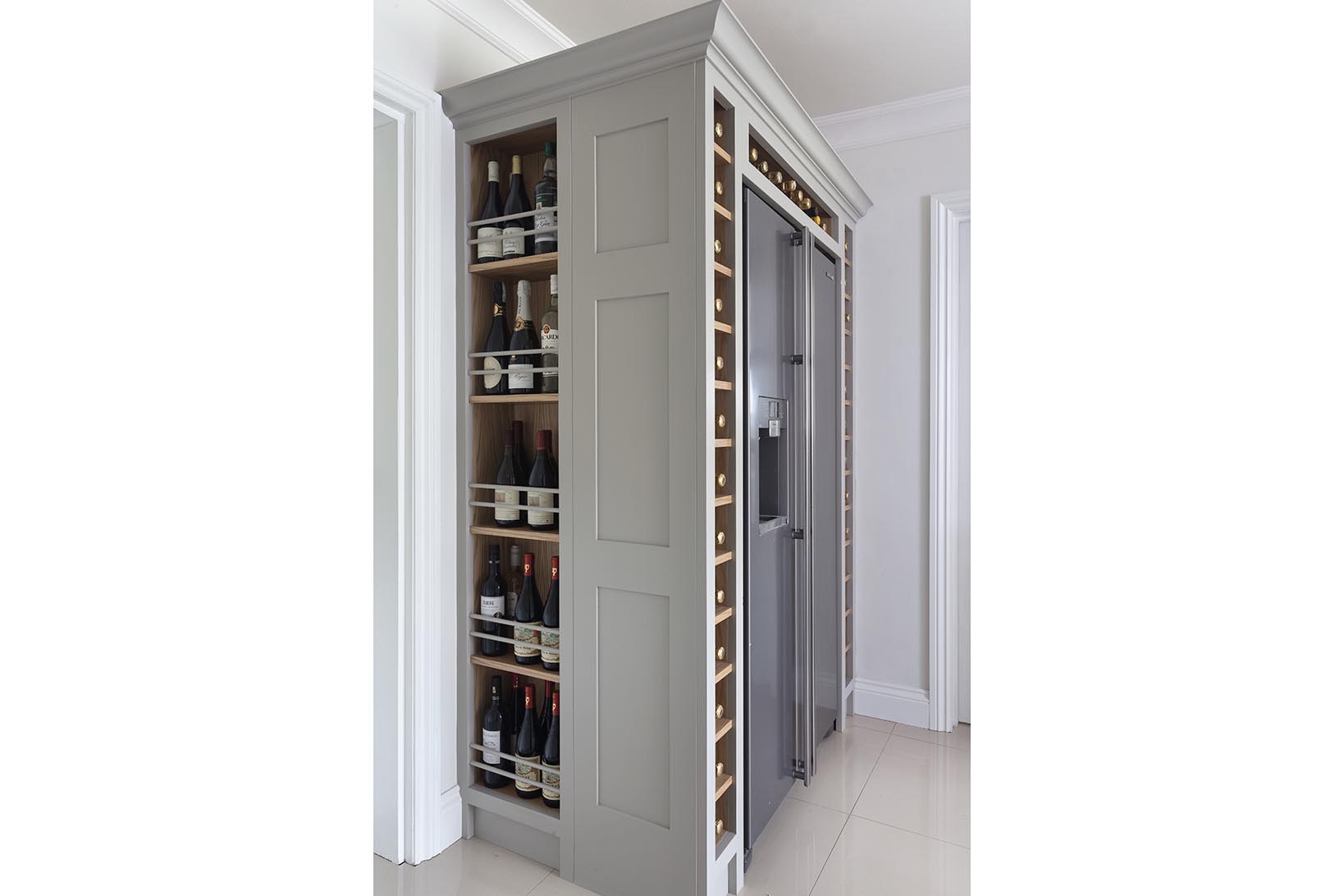 Samsung american style fridge freezer with wine storage built around it hand painted in Farrow & Ball Hardwick White.