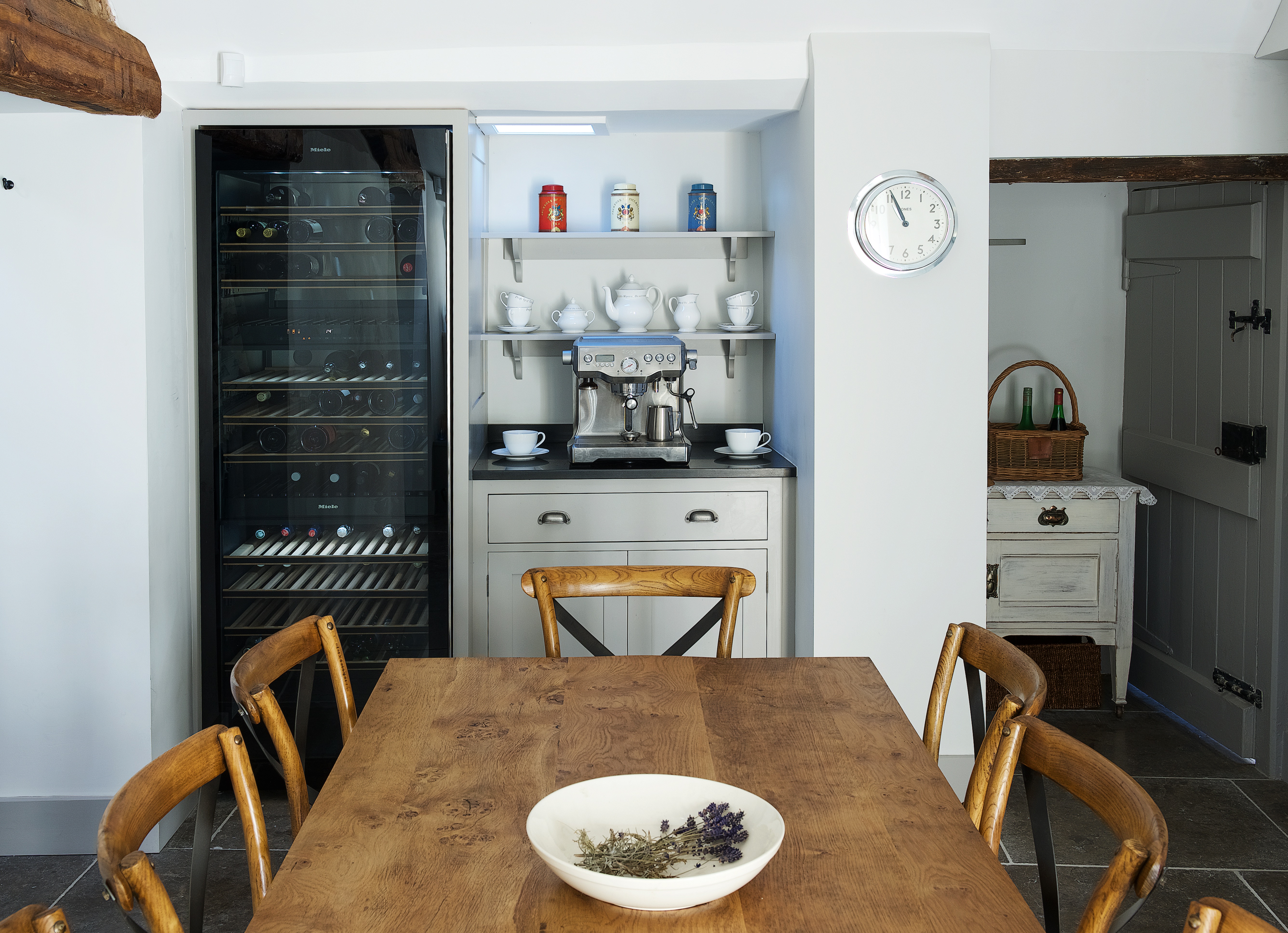 Miele wine fridge with bespoke shaker cabinets and shelves hand painted in Little Greene French Grey Dark with coffee machine.
