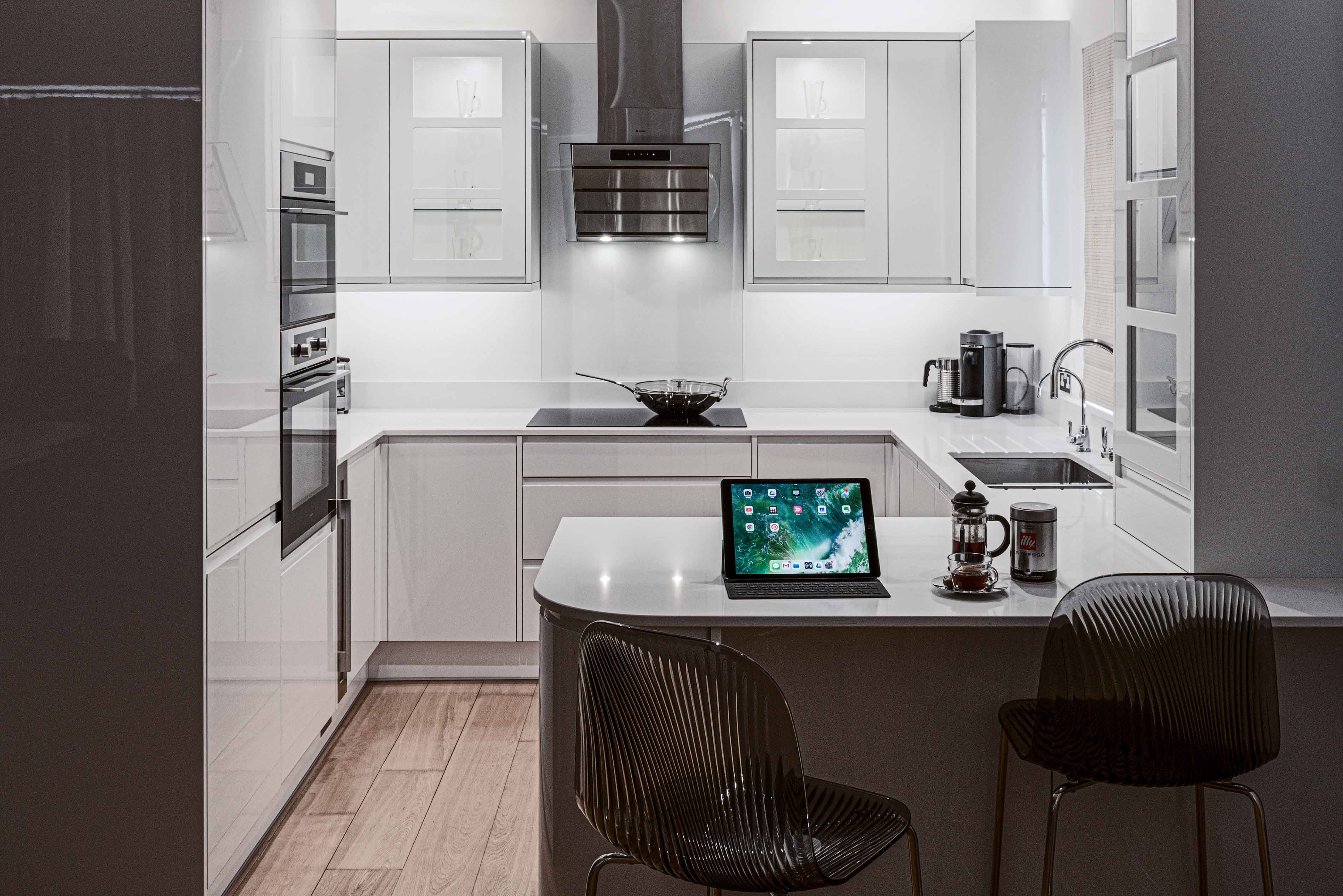 Contemporary modern luxury white designer bespoke kitchen neff oven miele fridge marble quartz granite tops Oxhshott Surrey