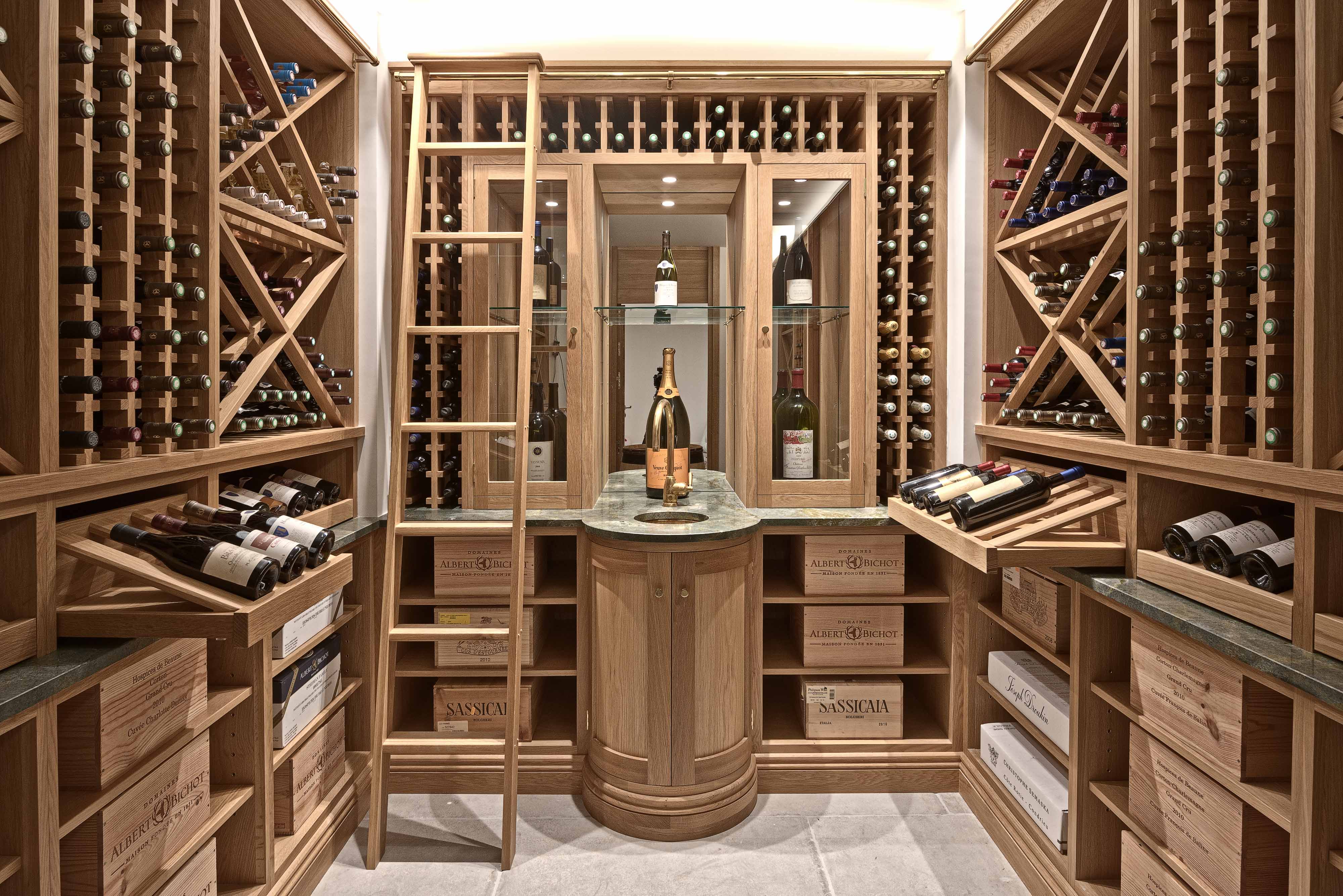 Bespoke wine cellar in oak finish with ladder flag stone floor in Guildford Surrey