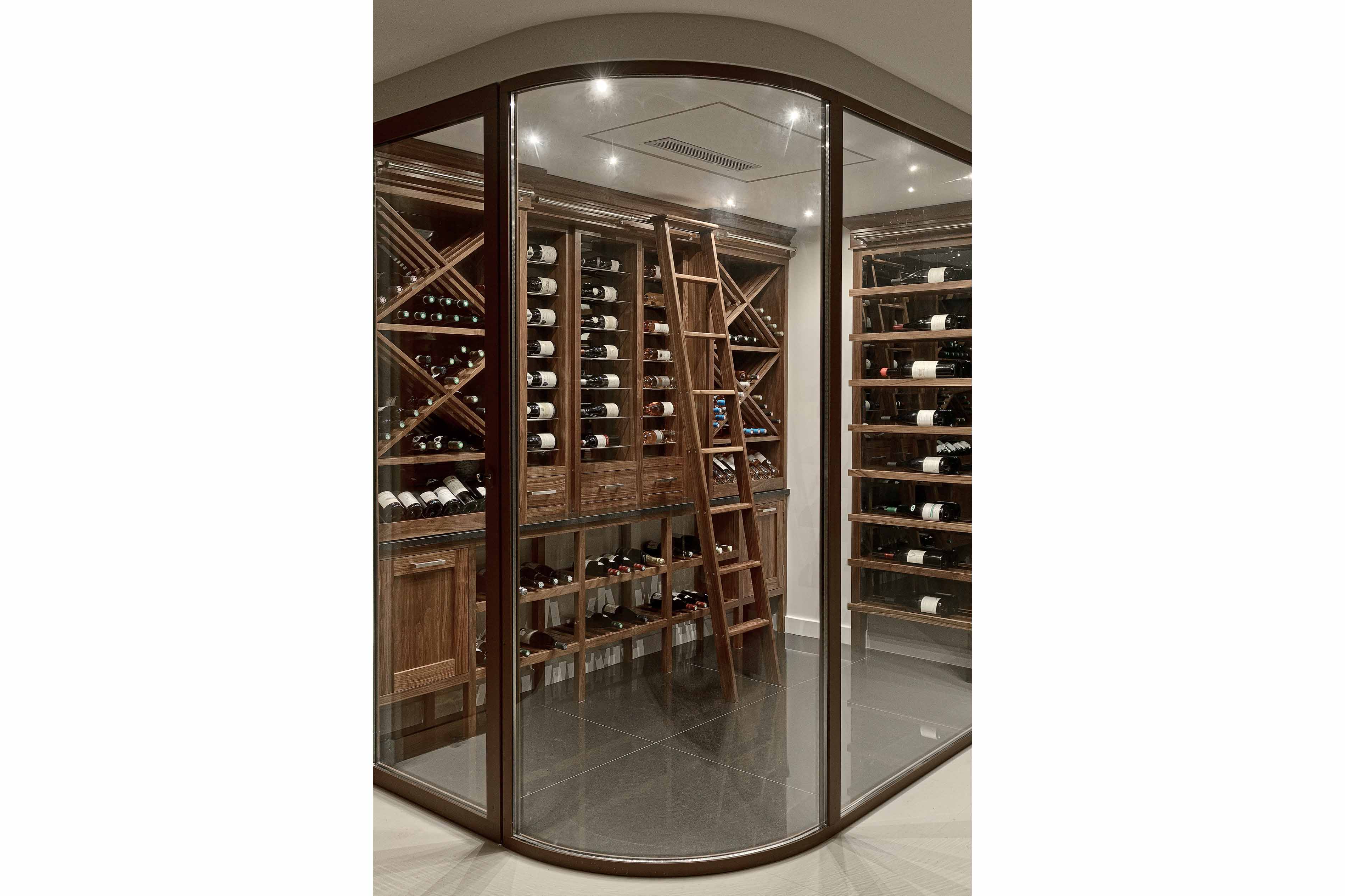 001. Bespoke wine room cellar in Walnut finish with ladder marble quartz in Guildford Surrey