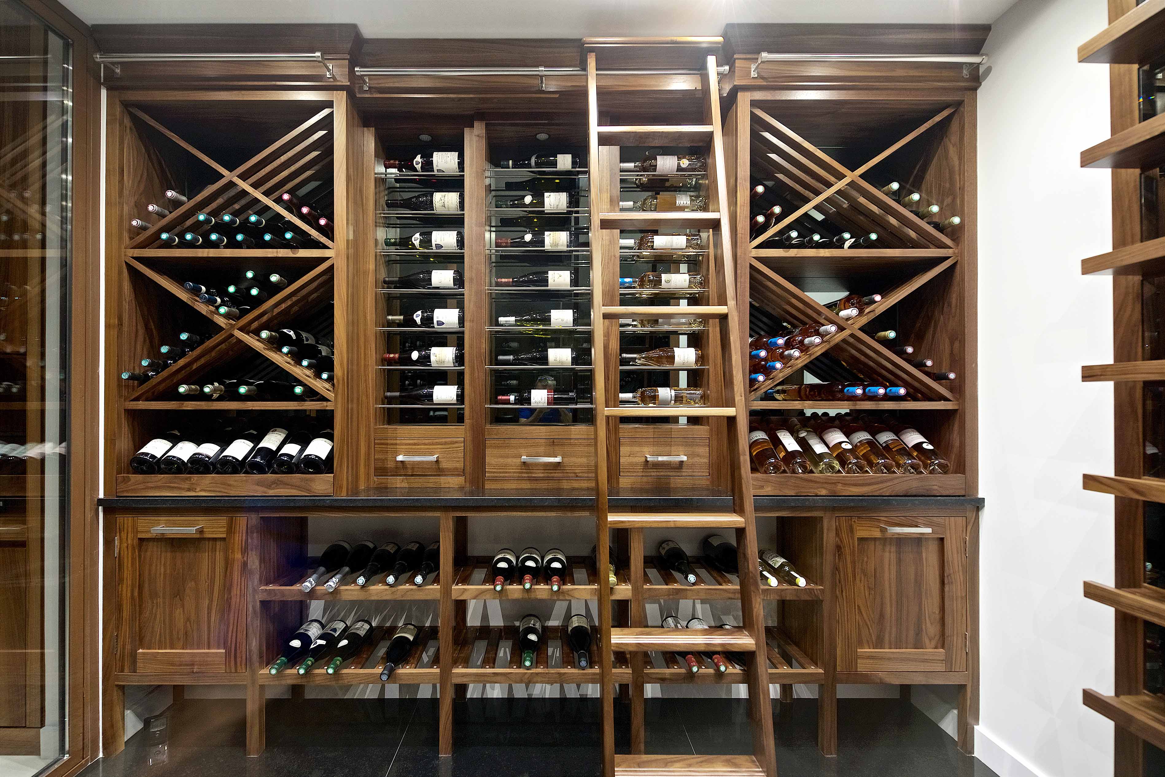 002. Bespoke wine room cellar in Walnut finish with ladder marble quartz in Guildford Surrey