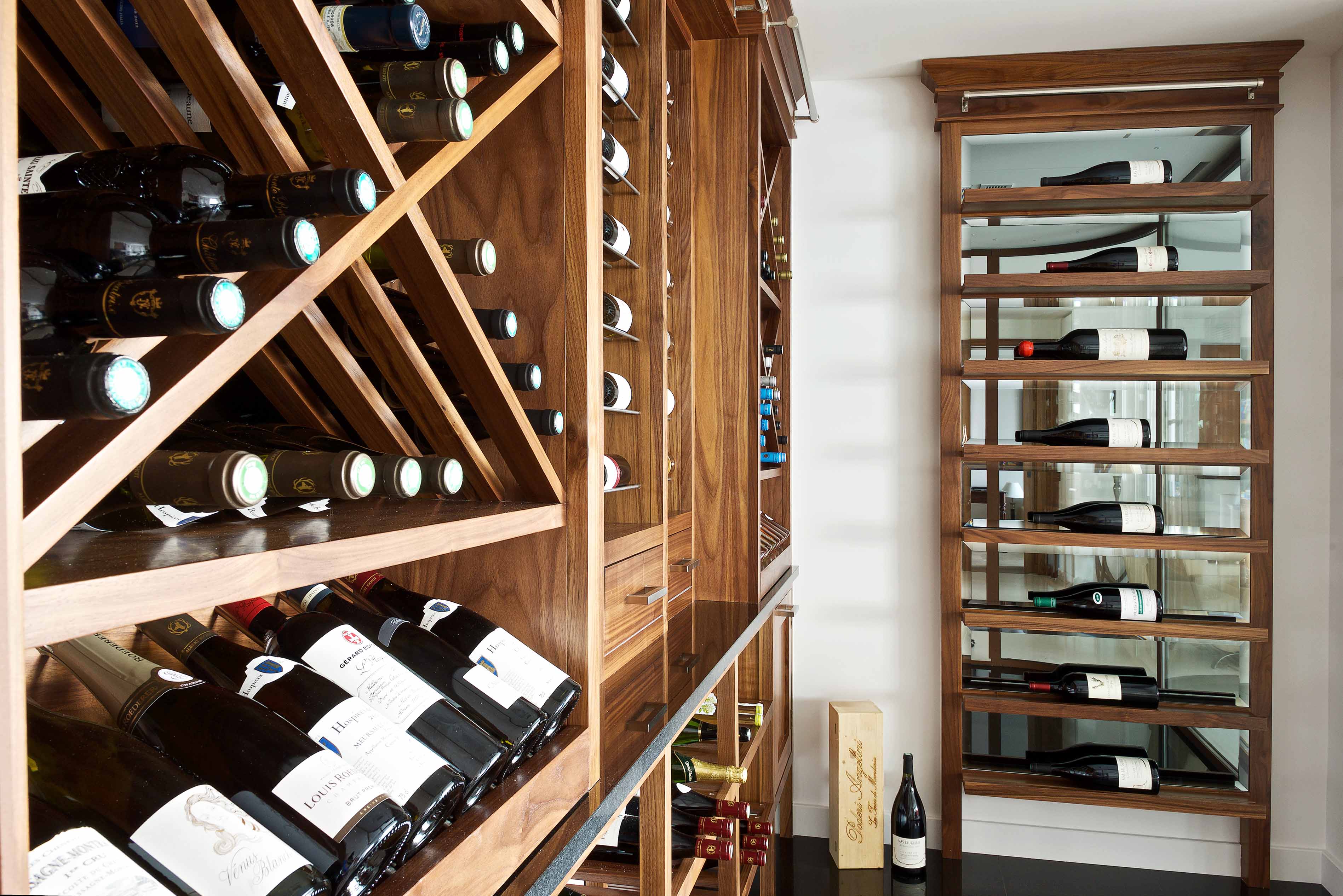 003. Bespoke wine room temperature controlled cellar in Walnut finish with ladder marble quartz in Farnham Surrey